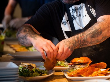 Chef assembling dishes in a kitchen
